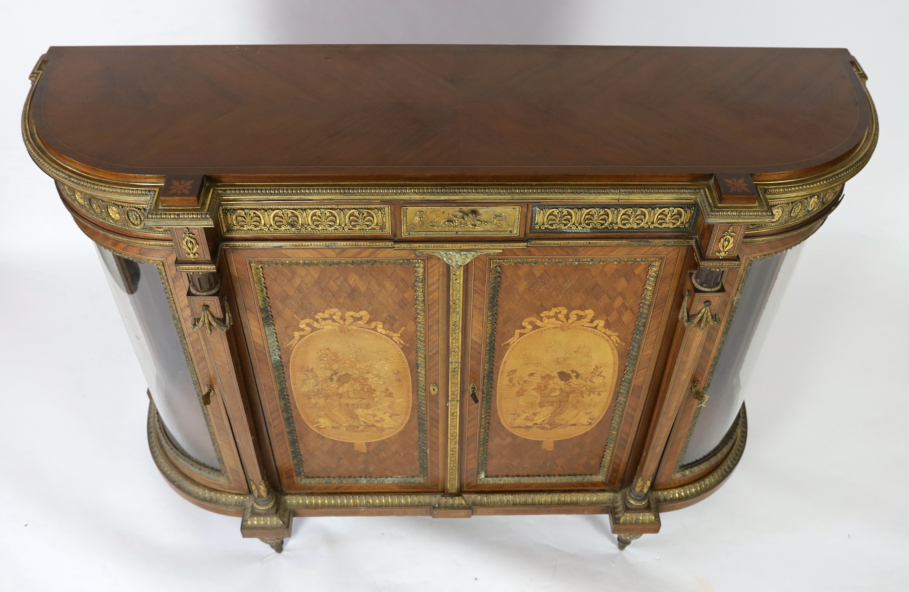 A late 19th century French Louis XVI style inlaid mahogany and ormolu mounted credenza